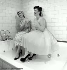 women laughing in tub